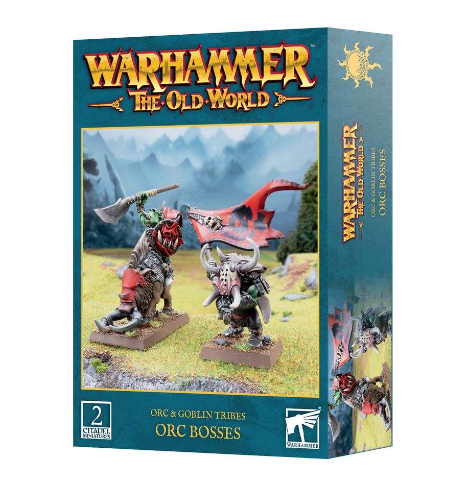 Teal Games Workshop box shown from the front and right side, featuring two armored orc boss miniatures, one riding a tusked boar and one carrying a red banner. The front reads “WARHAMMER THE OLD WORLD” and “ORC BOSSES.”