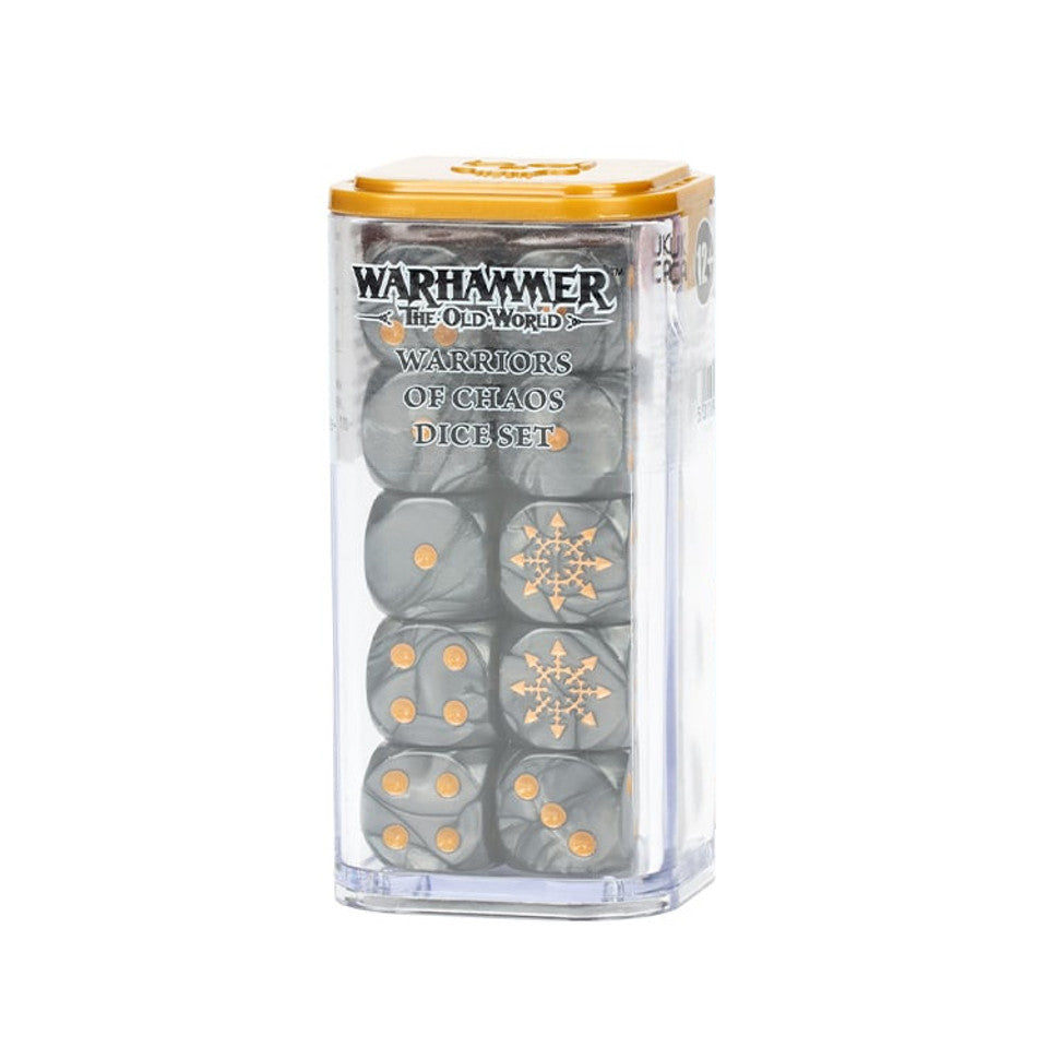 A clear rectangular container with a gold lid holds dark gray dice with gold pips and ornate faction symbols. The front reads “WARHAMMER THE OLD WORLD” and “WARRIORS OF CHAOS DICE SET.”
