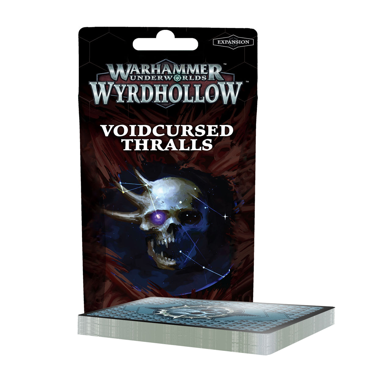 An upright black and dark red card package behind a thick deck with gray edges and a blue patterned top. The package shows a glowing skull with a purple eye and the text “WARHAMMER UNDERWORLDS WYRDHOLLOW,” “VOIDCURSED THRALLS,” and “EXPANSION.”