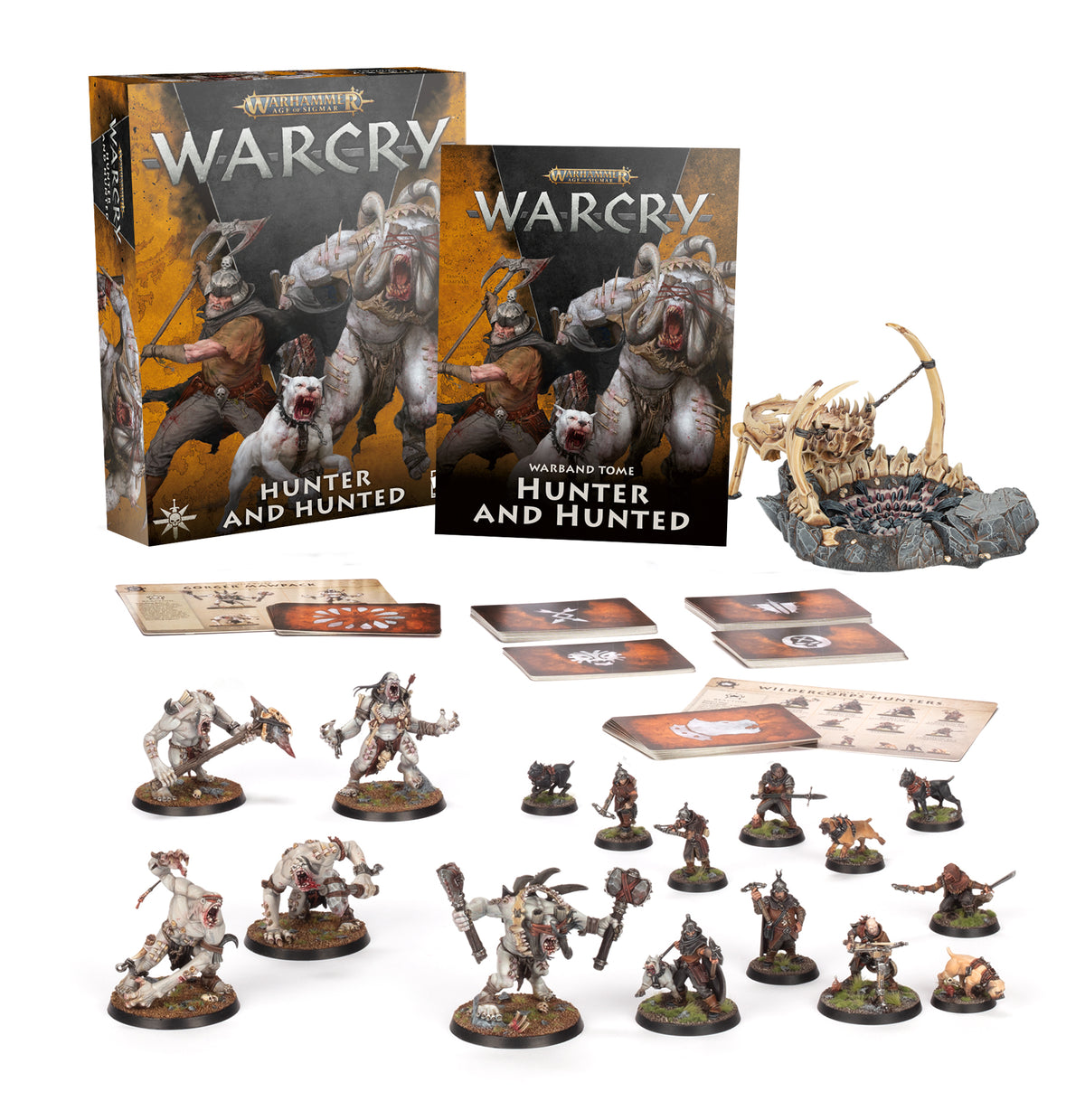 Warcry: Hunter and Hunted boxed game set, with illustrated orange-and-black packaging and a matching warband tome labeled “WARCRY” and “HUNTER AND HUNTED.” Painted pale ogre and hunter miniatures, a rocky scenery piece, cards and printed game sheets are arranged in front.