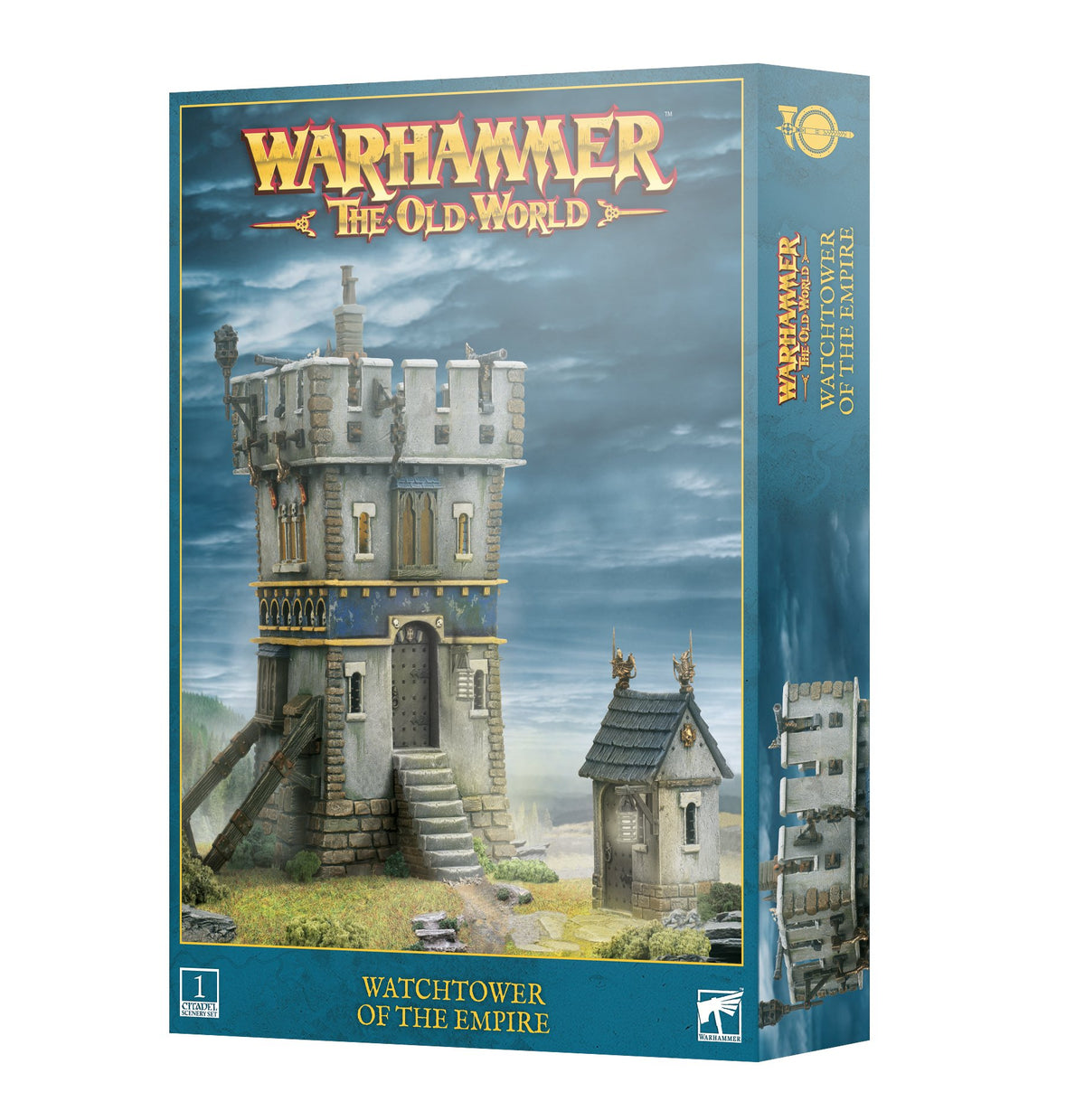 Box for a Watchtower of the Empire miniature terrain kit, showing a gray stone tower with blue-and-gold trim, stairs and ramparts beside a smaller roofed building. The teal package reads “WARHAMMER THE OLD WORLD” and “WATCHTOWER OF THE EMPIRE”; part of the tower is pictured on the side panel.