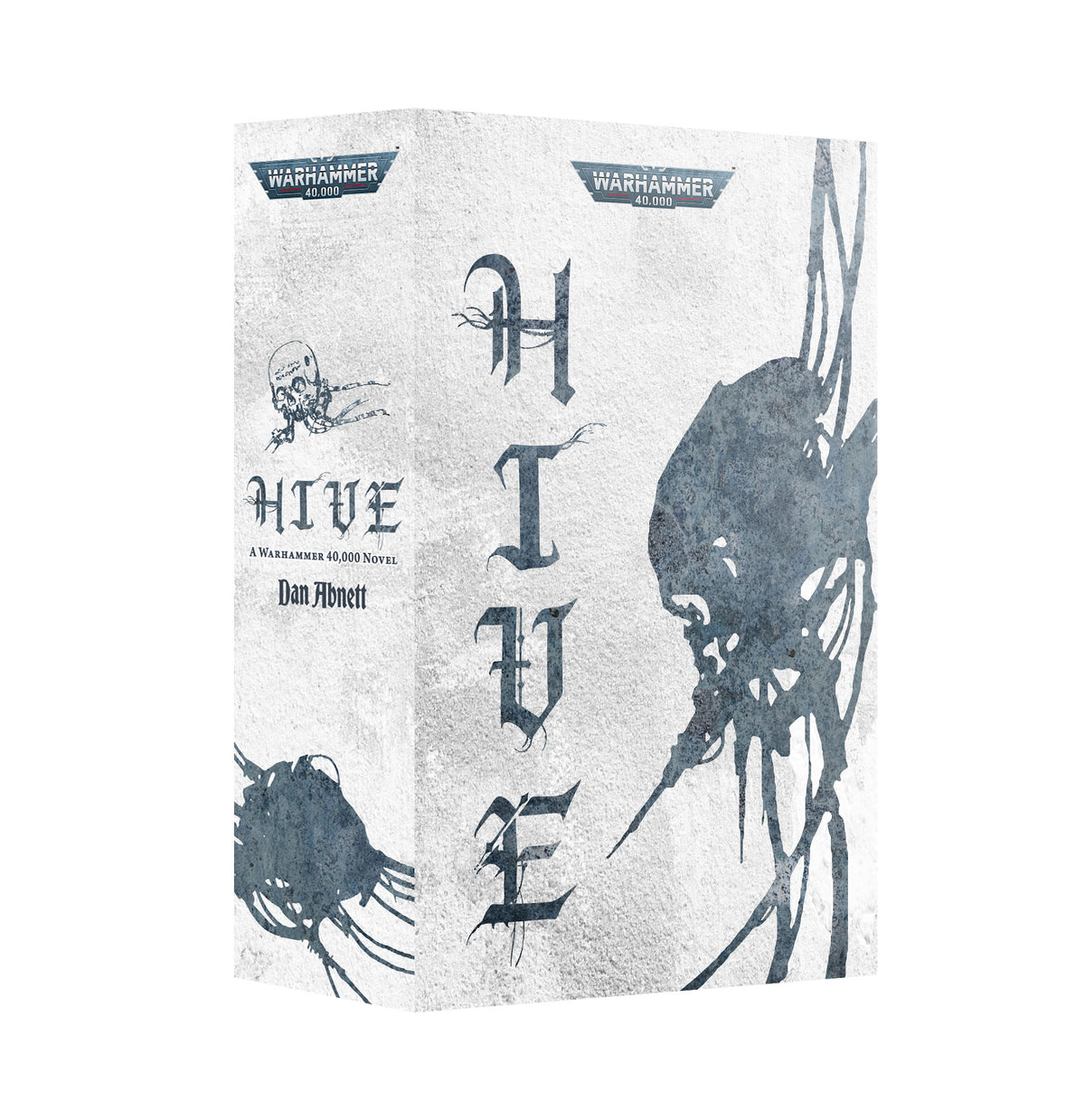 Hardback book shown at an angle revealing the spine and front cover on a textured off-white background. The front reads "HIVE" in tall dark gothic lettering beside a shadowy skull-like creature, topped by a "WARHAMMER 40,000" logo; the spine repeats the logo, a small skull, "HIVE", "A Warhammer 40,000 Novel" and author "Dan Abnett".