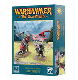 Teal Games Workshop box shown from the front and right side, featuring two armored orc boss miniatures, one riding a tusked boar and one carrying a red banner. The front reads “WARHAMMER THE OLD WORLD” and “ORC BOSSES.”