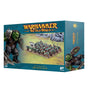 Teal Warhammer miniature box showing a painted mob of green Orc Boyz with shields and weapons on a battlefield, alongside artwork of a snarling orc. The box reads “WARHAMMER THE OLD WORLD” and “ORC BOYZ MOB.”