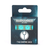 Dark blue Warhammer 40,000 T'au Empire dice box with a clear window showing pale dice marked with bright cyan T'au symbols. The front displays a large white T'au emblem and the text “WARHAMMER 40,000” and “T’AU EMPIRE DICE”.