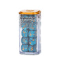 A clear rectangular case with an orange lid holds blue swirl-patterned dice with gold symbols and numerals. The front label reads “WARHAMMER THE OLD WORLD DICE SET.”