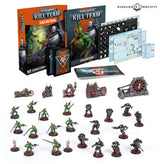 Kill Team: Salvation set arranged on white, with two illustrated boxes, cards, tokens and decal sheets, gray industrial terrain pieces, and rows of green and dark-armored miniatures on round bases. The boxes read “KILL TEAM” and “SALVATION.”