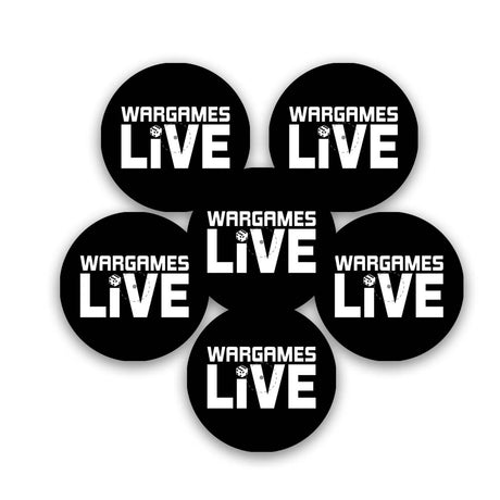 Six black circular gaming objective markers are arranged in a cluster on a white background. Each has bold white “WARGAMES LIVE” lettering with a small dice graphic integrated into the design.