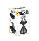White box with yellow accents for a black Citadel painting handle; the front shows the handle holding a gray miniature, while two side-panel diagrams show it holding miniatures on different bases. The box reads “CITADEL COLOUR” and “PAINTING HANDLE.”