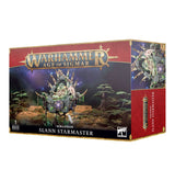 Box for the Seraphon Slann Starmaster miniature, shown from the front and right side. The front depicts a green amphibian seated on an ornate floating throne against a jungle and starry backdrop, with the text “WARHAMMER AGE OF SIGMAR” and “SERAPHON SLANN STARMASTER”; the side repeats the character artwork.