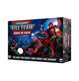 Warhammer 40,000 Kill Team: Ashes of Faith box, shown from the front and right side. The dark blue and red cover depicts a red-hooded armed figure amid a smoky battle; the front reads “KILL TEAM,” “ASHES OF FAITH,” and “THE HUNT FOR HERESY AMID SMOKE AND SHADOW.”