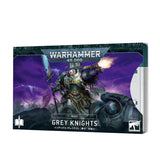 A stack of Grey Knights index cards shown with the illustrated cover facing forward, depicting armored warriors against a purple battlefield as one fires a weapon. The cover reads “WARHAMMER 40,000,” “INDEX,” and “GREY KNIGHTS”; card edges and a partial white card are visible at right.