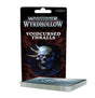 An upright black and dark red card package behind a thick deck with gray edges and a blue patterned top. The package shows a glowing skull with a purple eye and the text “WARHAMMER UNDERWORLDS WYRDHOLLOW,” “VOIDCURSED THRALLS,” and “EXPANSION.”