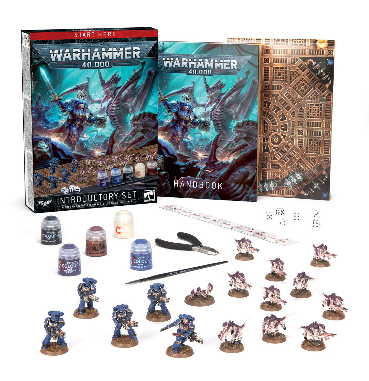 Warhammer 40,000 Introductory Set arranged on a white background, with a box and handbook marked “WARHAMMER 40,000,” plus blue-armored and pink alien miniatures, paints, brush, clippers, dice, ruler and printed terrain board. The box reads “START HERE” and “INTRODUCTORY SET.”