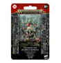 Packaged Gloomspite Gitz Rabble-Rowza miniature on a mossy scenic base, with a hunched goblin-like figure, horned red creature heads and red mushrooms with white spots. The red-and-black card reads “WARHAMMER AGE OF SIGMAR” and “GLOOMSPITE GITZ RABBLE-ROWZA.”