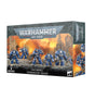A Warhammer 40,000 Space Marines: Terminator Squad box, shown from the front and right side. The front depicts six blue armored miniatures against an orange, ruined-city backdrop, with “WARHAMMER 40,000,” “SPACE MARINES TERMINATOR SQUAD,” and “6 MINIATURES” printed on the box.