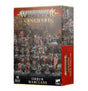 A Warhammer Age of Sigmar Vanguard: Orruk Warclans miniature box, shown from the front and right side. The front depicts a group of green-skinned fantasy warriors and beasts in a rocky swamp, with the text “WARHAMMER AGE OF SIGMAR,” “VANGUARD,” “ORRUK WARCLANS,” and “16 MINIATURES”; the red side panel has vertical product lettering.