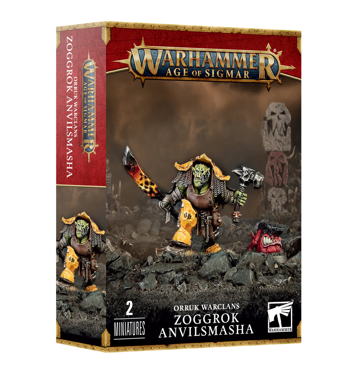Box for two Orruk Warclans miniatures, showing a green-faced armored warrior with a flaming sword and a smaller red creature on rocky ground; the front and left side of the box are visible. Text reads “WARHAMMER AGE OF SIGMAR” and “ZOGGROK ANVILSMASHA.”