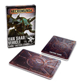 Necromunda Van Saar vehicle tactics cards shown with their illustrated box and two cards featuring weathered rust-red and blue geometric designs with a central emblem; one card reads “TACTICS CARD.” The box reads “NECROMUNDA” and “VAN SAAR VEHICLE GANG TACTICS CARDS.”
