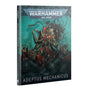Angled view of a Codex: Adeptus Mechanicus book showing its teal, black, and red illustrated cover and dark spine. A central hooded, mechanically augmented figure stands among armored soldiers beneath the text “WARHAMMER 40,000” and “CODEX ADEPTUS MECHANICUS.”
