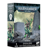 Warhammer 40,000 Necrons Overlord miniature box, shown from the front and left side. The artwork features a silver-and-green armored figure with flowing green geometric effects; the box reads “WARHAMMER 40,000,” “NECRONS,” and “OVERLORD WITH TRANSLOCATION SHROUD.”