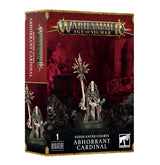 A red, black and gold Games Workshop box shows a pale, skeletal fantasy cleric miniature holding a tall skull-topped staff, with spiked armor and a round base. The front and side panels read “WARHAMMER AGE OF SIGMAR” and “ABHORRANT CARDINAL.”