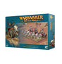 Teal Games Workshop box showing artwork of three skeletal chariots pulled by bone horses, with skeletons aboard; an illustrated chariot and skeletons appear along the left edge. The front reads “WARHAMMER THE OLD WORLD” and “TOMB KINGS OF KHEMRI SKELETON CHARIOTS.”