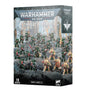 Dark Angels Combat Patrol miniature set box shown at a slight angle, with artwork of green and cream-armored figures fighting across a rocky battlefield. The front reads “WARHAMMER 40,000,” “COMBAT PATROL” and “DARK ANGELS,” and shows a white winged insignia.