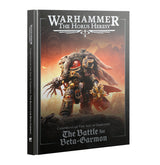 Hardcover campaign book shown upright with its front cover and spine visible. The dark cover features an ornate armored warrior against an orange, smoky battlefield and the titles “WARHAMMER THE HORUS HERESY” and “The Battle for Beta-Garmon.”