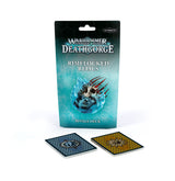 A teal-and-black Warhammer Underworlds package stands upright, showing an icy skull pierced by red spikes and the text “RIMELOCKED RELICS” and “RIVALS DECK.” Two cards lie below, one with a blue patterned back and one with a gold patterned back.