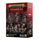 A red and black Warhammer game box shown from the front and right side, with gold trim and artwork of pale, armored fantasy figures and mounted warriors. The front reads “WARHAMMER AGE OF SIGMAR,” “SPEARHEAD” and “15 CITADEL MINIATURES”; the side reads “SPEARHEAD FLESH-EATER COURTS.”