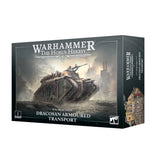 Box for a Warhammer miniature kit, shown from the front and right side. The front depicts a tan and dark green armored transport in a smoky battlefield, with “WARHAMMER THE HORUS HERESY” and “SOLAR AUXILIA DRACOSAN ARMOURED TRANSPORT”; the side shows another view of the vehicle.