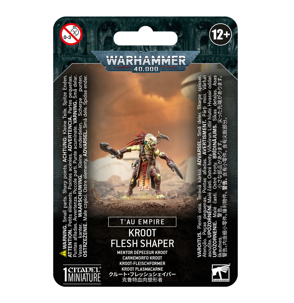 Front of a Warhammer 40,000 miniature package showing a green-skinned warrior with a red feathered crest, layered armor and blades against an orange scene. The packaging reads “WARHAMMER 40,000” and “KROOT FLESH SHAPER.”