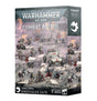 Front and right side of a Warhammer miniature set box, illustrated with armed sci-fi figures and a four-wheeled vehicle in a rocky scene. The front reads “WARHAMMER 40,000,” “COMBAT PATROL,” and “GENESTEALER CULTS,” with a white cult emblem on the side.