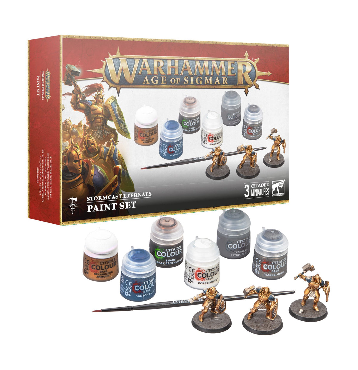 Warhammer Age of Sigmar Stormcast Eternals paint set shown with its red-and-white box, six paint pots, a brush and three gold-armored miniatures on round bases. The box reads “WARHAMMER AGE OF SIGMAR” and “STORMCAST ETERNALS PAINT SET.”