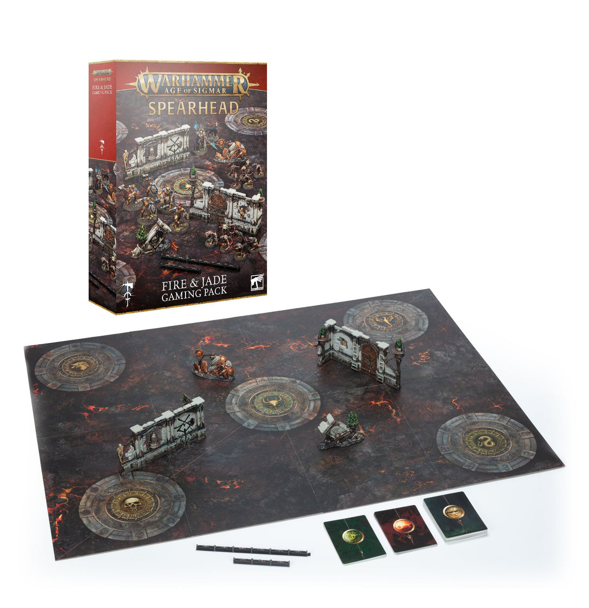 A Warhammer Age of Sigmar Spearhead box stands behind a dark game board printed with glowing red cracks and circular objectives, set up with small terrain pieces and figures; cards and range rulers sit in front. The box reads “WARHAMMER AGE OF SIGMAR,” “SPEARHEAD” and “FIRE & JADE GAMING PACK.”