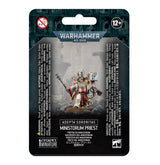 Front of a dark teal and black Warhammer 40,000 package, showing a robed, ornate Ministorum Priest miniature with a staff and book on a rocky base. The labels read “WARHAMMER 40,000,” “ADEPTA SORORITAS” and “MINISTORUM PRIEST.”