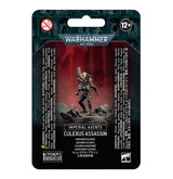 Front of a dark teal and black Warhammer package with a Culexus Assassin miniature in dark armor, posed on a rocky base against a red backdrop. The card reads “WARHAMMER 40,000,” “IMPERIAL AGENTS” and “CULEXUS ASSASSIN.”