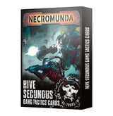 Box for a card game, shown from the front and right side. The dark cover depicts armored fighters in a blue-green battle scene with a skull emblem and the text “NECROMUNDA” and “HIVE SECUNDUS GANG TACTICS CARDS”; the title repeats vertically on the side.