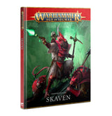Upright hardcover Chaos Battletome: Skaven, shown at an angle with a red spine and green-and-red cover art of armored rat-like warriors around a central figure wielding a staff and glowing green magic. The cover reads “WARHAMMER AGE OF SIGMAR” and “SKAVEN.”