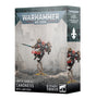 Warhammer 40,000 miniature box shown from the front and right side, with artwork of a flying Canoness in dark armor and red accents, carrying a sword and wearing a jump pack. The box reads “WARHAMMER 40,000” and “CANONESS WITH JUMP PACK.”