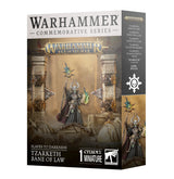 Box for a Citadel miniature, shown from the front and right side. The front depicts a horned figure in dark armor holding a spiked staff and green object among ruined pillars; text reads “WARHAMMER COMMEMORATIVE SERIES” and “TZARKETH BANE OF LAW.”