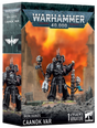 Product box for the Warhammer 40,000 Iron Hands "CAANOK VAR" kit, labeled "1 CITADEL MINIATURE". The cover shows a black Terminator-armored figure with mechanical arms, a weapon and a skull-topped staff against a fiery orange ruin backdrop, with a side panel repeating the figure.
