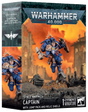 Retail box for a Warhammer 40,000 miniature showing a painted Space Marine Captain in blue power armor with gold trim, a jump pack with a sunburst halo, a thunder hammer and a relic shield, posed over rubble against an orange sky and gothic ruins. The box reads "WARHAMMER 40,000" and "SPACE MARINES CAPTAIN WITH JUMP PACK AND RELIC SHIELD" with "1 CITADEL MINIATURE".