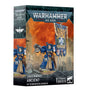 Product box for the Warhammer 40,000 kit "SPACE MARINES ANCIENT IN TERMINATOR ARMOUR", shown at an angle revealing front and side panels. The front depicts a painted blue-armoured Space Marine in bulky Terminator armour holding a storm bolter and a tall banner with an eagle emblem, set against an orange sky and ruins, with "WARHAMMER 40,000" at the top and "1 CITADEL MINIATURE" at the bottom.