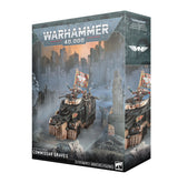 Product box for a Warhammer 40,000 kit shown at an angle with front and side panels visible. The cover art depicts a black and bronze armored vehicle carrying armed figures, one holding a red banner with a winged emblem, set against gothic ruins. Text reads "WARHAMMER 40,000" and "ASTRA MILITARUM COMMISSAR GRAVES".