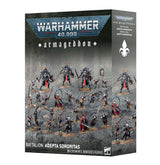 Product box for the Warhammer 40,000 "armageddon" Battalion: Adepta Sororitas set, shown at an angle with front and side panel. The front displays the "WARHAMMER 40,000" logo and gothic "armageddon" title above painted miniatures of armored sisters in black and silver with red cloaks on rocky terrain, with "BATTALION: ADEPTA SORORITAS" and "24 CITADEL MINIATURES/FIGURINES" at the bottom; the side panel repeats the titles with a white fleur-de-lis symbol.