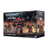 Boxed Warhammer 40,000 set shown at an angle revealing front and side panels. The front artwork depicts four red, black and yellow armored knight mechs with mounted weapons against a smoky battlefield, with the "WARHAMMER 40,000" logo, "EYE OF TERROR" title and "BATTALION: IMPERIAL KNIGHTS" text, plus "3 CITADEL MINIATURES/FIGURINES" along the bottom.