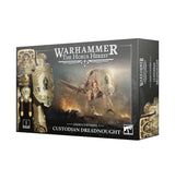 Product box for the Legio Custodes Custodian Dreadnought miniature kit, shown at an angle on white. The dark grey box features artwork of a gold armored figure with a shield and sword, with the text "WARHAMMER THE HORUS HERESY" at top and "LEGIO CUSTODES CUSTODIAN DREADNOUGHT" at bottom, plus a Games Workshop logo and a "1 CITADEL MINIATURE" badge.