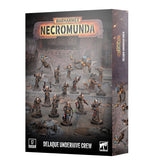 Box packaging for the Warhammer Necromunda "Delaque Underhive Crew" set, shown at an angle revealing the front and side panels. The cover displays painted miniatures of robed, pale-faced figures holding weapons alongside orange-and-blue mechanical creatures on an industrial backdrop, with the "WARHAMMER NECROMUNDA" logo at top and a "17 Citadel Miniatures" badge at bottom.